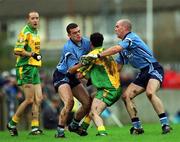 10 February 2002; Damien Diver of Donegal, is tackled by Paul Casey, left, and James O'Connor of Dublin during the Allianz National Football League Division 1A Round 1 match between Dublin and Donegal at Parnell Park in Dublin. Photo by Ray McManus/Sportsfile