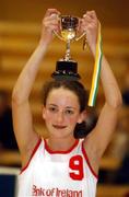 11 February 2002; St Catherine's captain Niamh McKenna lifts the cup after victory over Cabinteely in the Bank of Ireland Schools Cup U16 &quot;C&quot; Girls Final match between Cabinteely Community School, Dublin, and St Catherine's Vocational school, Killybegs, Donegal, at the ESB Arena in Tallaght, Dublin. Photo by Brendan Moran/Sportsfile