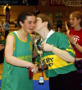 12 February 2002; Presentation Listowel captain Andrina Carmody is presented with the cup by Jenny Tarrant of Bank of Ireland following the Bank of Ireland Schools Cup U16 &quot;A&quot; Girls Final match between Ursuline College, Sligo, and Presentation Listowel, Kerry, at the ESB Arena in Tallaght, Dublin. Photo by Brendan Moran/Sportsfile