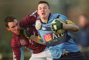 12 February 2002; Shay Ronaghaan of UCD is tackled by Declan Crushell of GMIT during the Sigerson Cup Semi-Final match between UCD and GMIT at the Belfield Bowl in Dublin. Photo by Aofie Rice/Sportsfile