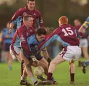 12 February 2002; Noel McGuire of  UCD is tackled by Joe Bergin, left and team-mate Damien Burke, both of GMIT during the Sigerson Cup Semi-Final match between UCD and GMIT at the Belfield Bowl in Dublin. Photo by Aofie Rice/Sportsfile