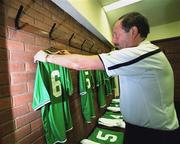 13 February 2002; Joe Walsh, Equipment Officer to The Republic of Ireland Soccer Team, hangs Roy Keane's jersey ahead of the International Friendly match between Republic of Ireland and Russia at Lansdowne Road in Dublin. Photo by David Maher/Sportsfile