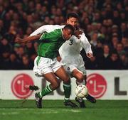 13 February 2002; Clinton Morrison of Republic of Ireland in action against Yuri Nikiforov of Russia during the International Friendly match between Republic of Ireland and Russia at Lansdowne Road in Dublin. Photo by David Maher/Sportsfile