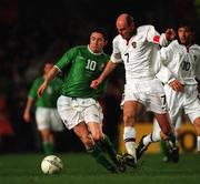 13 February 2002; Robbie Keane of Republic of Ireland in action against Viktor Onopko of Russia during the International Friendly match between Republic of Ireland and Russia at Lansdowne Road in Dublin. Photo by David Maher/Sportsfile
