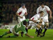 15 February 2002; Andy Goode of England A, breaks past Mike Mullins of Ireland A during the &quot;A&quot;  Rugby International match between England and Ireland at Franklin Gardens in Northampton, England. Photo by Sportsfile