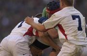 16 February 2002; Anthony Foley of Ireland, is tackled by Graham Rowntree, left, and Neil Back,right, both of England, during the Lloyds TSB Six Nations Championship match between England and Ireland at Twickenham Stadium in London, England. Photo by Brendan Moran/Sportsfile