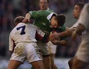 16 February 2002; Brian O'Driscoll of Ireland, is tackled by Neil Back, left, and Ben Cohen of England during the Lloyds TSB Six Nations Championship match between England and Ireland at Twickenham Stadium in London, England. Photo by Brendan Moran/Sportsfile