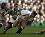 16 February 2002; Jason Robinson of England, is tackled by Brian O'Driscoll of Ireland during the Lloyds TSB Six Nations Championship match between England and Ireland at Twickenham Stadium in London, England. Photo by Brendan Moran/Sportsfile