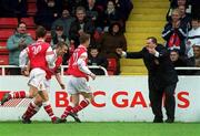 17 February 2002; Robbie Griffin of St Patrick's Athletic, centre, celebrates with team-mates Paul Marney, 30, Trevor Croly and manager Pat Dolan, right, after scoring his side's first goal during the eircom League Premier Division match between St Patrick's Athletic and Cork City at Richmond Park in Dublin. Photo by Brian Lawless/Sportsfile