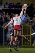 17 February 2002; Ciaran Whelan of Dublin, fields a high ball ahead of team-mate Darren Magee and Jarlath Quinn of Tyrone during the Allianz National Football League Division 1A Round 2 match between Tyrone and Dublin at O'Neill Park in Dungannon, Tyrone. Photo by Brendan Moran/Sportsfile