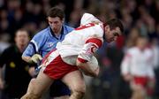 17 February 2002; Jarlath Quinn of Tyrone, in action against Eoin Bennis of Dublin during the Allianz National Football League Division 1A Round 2 match between Tyrone and Dublin at O'Neill Park in Dungannon, Tyrone. Photo by Brendan Moran/Sportsfile