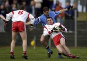 17 February 2002; Jarlath Quinn of Tyrone in action against Darren Magee of Dublin during the Allianz National Football League Division 1A Round 2 match between Tyrone and Dublin at O'Neill Park in Dungannon, Tyrone. Photo by Brendan Moran/Sportsfile