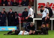 17 February 2002; Alan Bennett of Cork City receives medical attention before being stretchered off and substituted during the eircom League Premier Division match between St Patrick's Athletic and Cork City at Richmond Park in Dublin. Photo by Brian Lawless/Sportsfile