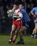 17 February 2002; Ciaran Gourley of Tyrone, in action against Ciaran Whelan of Dublin during the Allianz National Football League Division 1A Round 2 match between Tyrone and Dublin at O'Neill Park in Dungannon, Tyrone. Photo by Brendan Moran/Sportsfile