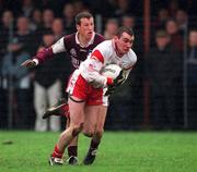 10 February 2002; Jarlath Quinn of Tyrone in action against Gary Fahey of Galway during the Allianz National Football League Division 1A Round 1 match between Galway and Tyrone at Duggan Park in Ballinasloe, Galway. Photo by Damien Eagers/Sportsfile