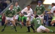 16 February 2002; Jonny Wilkinson of England, is tackled by David Wallace  of Ireland, watched by Peter Stringer, left, and David Humphreys during the Lloyds TSB Six Nations Championship match between England and Ireland at Twickenham Stadium in London, England. Photo by Brendan Moran/Sportsfile