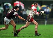 10 February 2002; Jarlath Quinn of Tyrone in action against Sean O'Domhnaill of Galway during the Allianz National Football League Division 1A Round 1 match between Galway and Tyrone at Duggan Park in Ballinasloe, Galway. Photo by Damien Eagers/Sportsfile
