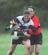 19 February 2002; Joanne O'Sullivan of UCD in action against Aoife Murphy of UCC during the Higher Education League Ladies Football Final between UCD and UCC at  Donnybrook in Dublin. Photo by Aofie Rice/Sportsfile