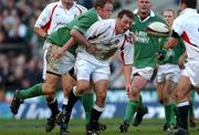 16 February 2002; Steve Thompson of England, passes to a team-mate bespite the tackle of Mick Galwey of Ireland during the Lloyds TSB Six Nations Championship match between England and Ireland at Twickenham Stadium in London, England. Photo by Matt Browne/Sportsfile