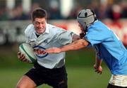 23 February 2002; Ronan O'Gara of Cork Constitution is tackled by Conor Hartigan of Garryowen during the AIB All-Ireland League Division 1 match between Cork Constitution and Garryowen at Temple Hill in Cork. Photo by Matt Browne/Sportsfile