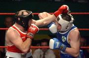 22 February 2002; Cathal McMonagle, right, in action against Eanna Falvey during the Super Heavyweight Final between Eanna Falvey and Cathal McMonagle during the National Senior Boxing Championships at the The National Stadium in Dublin. Photo by Damien Eagers/Sportsfile