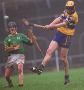 24 February 2002; Tony Griffin of Clare in action against Anton O'Neill of Meath during the Allianz National Hurling League Division 1 Round1 match between Clare and Meath at Pairc Tailteann in Navan, Meath. Photo by Aofie Rice/Sportsfile