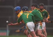 24 February 2002; Tony Carmody of Clare is tackled by Anton O'Neill, 7, and team-mate Ray Dorran, both of Meath, during the Allianz National Hurling League Division 1 Round1 match between Clare and Meath at Pairc Tailteann in Navan, Meath. Photo by Aofie Rice/Sportsfile