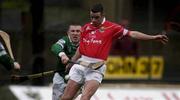 25 February 2002; Mark Prendergast of Cork in action against Mark Foley of Limerick during the Allianz National Hurling League Division 1B Round 1 match between Limerick and Cork at the Gaelic Grounds in Limerick. Photo by Brendan Moran/Sportsfile