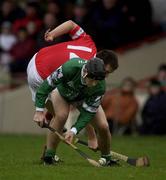25 February 2002; TJ Ryan of Limerick in action against Alan Browne of Cork during the Allianz National Hurling League Division 1B Round 1 match between Limerick and Cork at the Gaelic Grounds in Limerick. Photo by Brendan Moran/Sportsfile