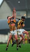 24 February 2002; Martin Comerford, right, and J.J Delaney, both of Kilkenny, in action against Pat Fitzgerald of Waterford during Allianz National Hurling League Division 1A Round 1 match between Kilkenny and Waterford in Nowlan Park, Kilkenny. Photo by Damien Eagers/Sportsfile