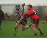 19 February 2002; Brian Hogan of UCD in action against Eoin Morrissey of UCC during the Fitzgibbon Cup Final Replay match between UCD and UCC at McDonagh Park in Nenagh, Tipperary. Photo by Photo by Matt Browne/Sportsfile
