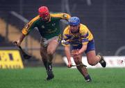 24 February 2002; Tony Carmody of Clare in action against Brian Perry of Meath during the Allianz National Hurling League Division 1 Round1 match between Clare and Meath at Pairc Tailteann in Navan, Meath. Photo by Aofie Rice/Sportsfile
