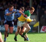 23 February 2002; Pascal Kelleghan of Offaly in action against Jonathan Magee of Dublin during the Allianz National Football League Division 1A match between Offaly and Dublin at O'Connor Park in Tullamore, Offaly. Photo by Brian Lawless/Sportsfile