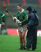 25 February 2002; Ciaran Carey of Limerick dries his hurl during the Allianz National Hurling League Division 1B Round 1 match between Limerick and Cork at the Gaelic Grounds in Limerick. Photo by Brendan Moran/Sportsfile