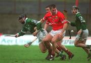 25 February 2002; Owen Foley of Limerick is tackled by Mark Prendergast and Diarmuid O'Sullivan of Cork during the Allianz National Hurling League Division 1B Round 1 match between Limerick and Cork at the Gaelic Grounds in Limerick. Photo by Brendan Moran/Sportsfile