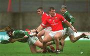 25 February 2002; Diarmuid O'Sullivan of Cork, attempts to get possession ahead of Owen Foley of Limerick during the Allianz National Hurling League Division 1B Round 1 match between Limerick and Cork at the Gaelic Grounds in Limerick. Photo by Brendan Moran/Sportsfile