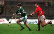 25 February 2002; Mark Keane of Limerick, in action against Diarmuid O'Sullivan of Cork during the Allianz National Hurling League Division 1B Round 1 match between Limerick and Cork at the Gaelic Grounds in Limerick. Photo by Brendan Moran/Sportsfile