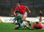 25 February 2002; Mark Keane of Limerick in action against Diarmuid O'Sullivan, right, and Mark Prendergast, both of Cork, during the Allianz National Hurling League Division 1B Round 1 match between Limerick and Cork at the Gaelic Grounds in Limerick. Photo by Brendan Moran/Sportsfile