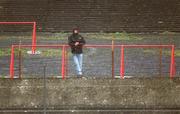 25 February 2002; A lone supporter stands in the terraces during the Allianz National Hurling League Division 1B Round 1match between Limerick and Cork at the Gaelic Grounds in Limerick. Photo by Brendan Moran/Sportsfile