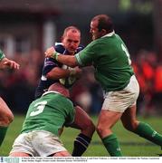 3 March 2002; Gregor Townsend, Scotland is tackled by John Hayes, 3, and Peter Clohessy, 1, Ireland.  Ireland v Scotland, Six Nations, Lansdowne Road, Dublin. Rugby. Picture credit; Brendan Moran / SPORTSFILE
