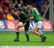 2 March 2002; Derek Kavanagh, Nemo Rangers, in action against Mark Caffrey, Charlestown Sarsfields. Nemo Rangers v Charlestown Sarsfields, AIB Club Championship semi-final, McDonagh Park, Nenagh, Co. Tipperary. Football. Picture credit; Damien Eagers / SPORTSFILE