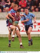 3 March 2002; Michael Ennis, Westmeath, is tackled by Declan Darcy, Dublin.  Dublin v Westmeath, National Football League, Parnell Park, Dublin. Picture credit; Ray McManus / SPORTSFILE