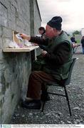 2 March 2002; A Ticket seller dispenses tickets before the game. Nemo Rangers v Charlestown Sarsfields, AIB Club Championship semi-final, McDonagh Park, Nenagh, Co. Tipperary. Football. Picture credit; Damien Eagers / SPORTSFILE