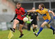 25 June 2011; Caolan Mooney, Down, in action against John Hayes, Clare. GAA Football All-Ireland Senior Championship Qualifier Round 1, Clare v Down, Cusack Park, Ennis, Co. Clare. Picture credit: Pat Murphy / SPORTSFILE