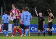 27 June 2011; UCD's Sean Harding, 2, is shown the red card by referee Robert Rogers. EA Sports Cup, Quarter-Final, UCD v Derry City, UCD Bowl, Belfield, Dublin. Picture credit: Pat Murphy / SPORTSFILE