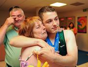 28 June 2011; Team Ireland's John Michael Gannon, Cloghan, Co. Offaly, with his parents Patricia and Christy after winning a Gold Medal in the Male Horizontal Bar and a Silver for his performance on the Parallel Bars at the Hellinikon Olympic Indoor Hall, Hellinikon Olympic Complex. 2011 Special Olympics World Summer Games, Athens, Greece. Picture credit: Ray McManus / SPORTSFILE