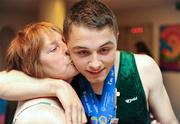 28 June 2011; Team Ireland's John Michael Gannon, Cloghan, Co. Offaly, with his mother Patricia after winning a Gold Medal in the Male Horizontal Bar and a Silver for his performance on the Parallel Bars at the Hellinikon Olympic Indoor Hall, Hellinikon Olympic Complex. 2011 Special Olympics World Summer Games, Athens, Greece. Picture credit: Ray McManus / SPORTSFILE