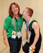 28 June 2011; Team Ireland's Alan Quinlan, Cappamore, Limerick, with coach Dorothy Kavanagh, Old Pallas, Co. Limerick, after he was presented with his Silver Medal for the Male Rings event at the Hellinikon Olympic Indoor Hall, Hellinikon Olympic Complex. 2011 Special Olympics World Summer Games, Athens, Greece. Picture credit: Ray McManus / SPORTSFILE