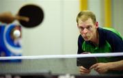 29 June 2011; Team Ireland's Robert Deegan, Ballinteer, Dublin, watches his opponent serve to him during the qualifying rounds of the Table Tennis at the SEF Sport Training Halls, Peace & Friendship Stadium, Athens, Greece. 2011 Special Olympics World Summer Games, Athens, Greece. Picture credit: Ray McManus / SPORTSFILE