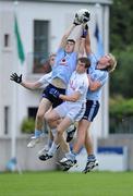 29 June 2011; Emmett O'Conghaile, left, and Patrick O'Higgins, Dublin, in action against Gavin Farrell, hidden, and Daniel Flynn, Kildare. Leinster GAA Football Minor Championship, Semi-Final, Dublin v Kildare, Parnell Park, Dublin. Picture credit: Matt Browne / SPORTSFILE